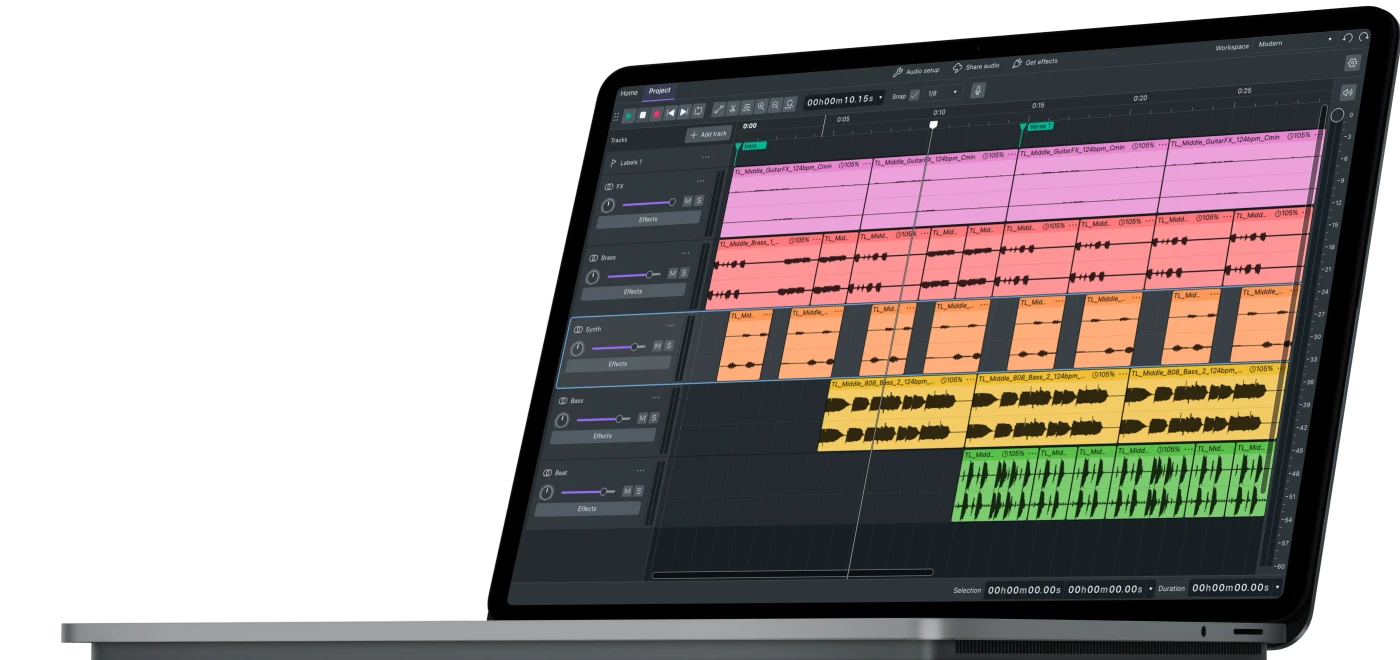 Audacity’s multitrack editor displayed on a laptop, with colored audio clips, waveforms, track controls and a timeline.